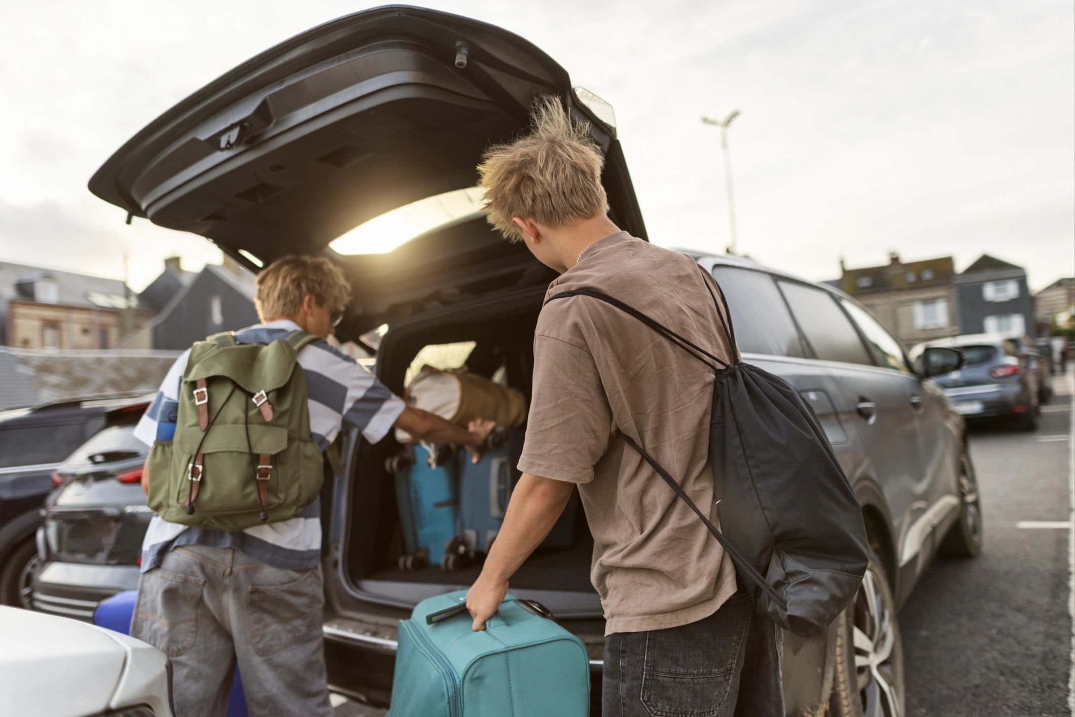 Family packing a car for a trip