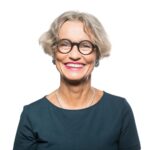 Portrait of smiling senior woman with eyeglasses